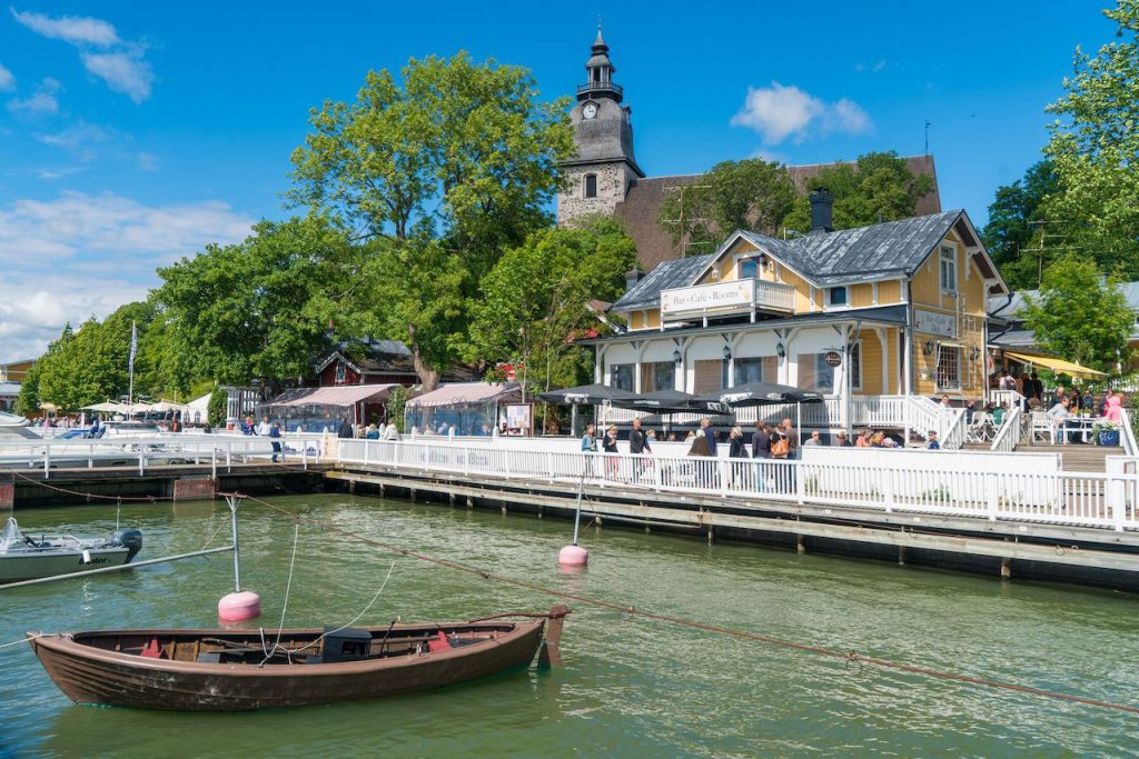 The-small-boat-harbour-and-Naantali-church-at-sunny-summer-day